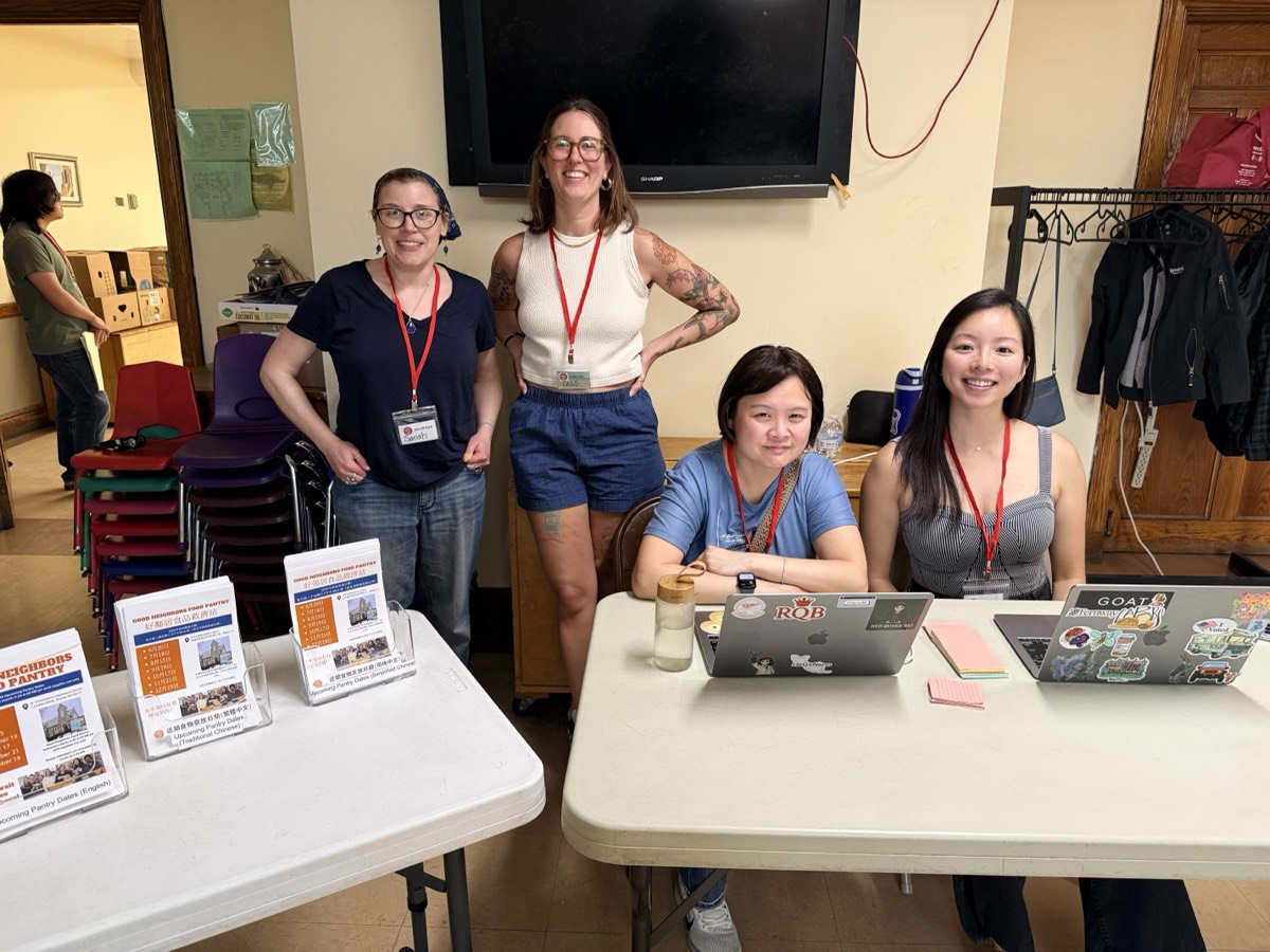 Good Neighbors volunteers at the welcome desk on a pantry day